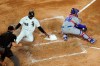 Chicago White Sox's Luis Robert (88) scores past Texas Rangers catcher Jose Trevino on Yermin Mercedes' two-run single during the third inning of a baseball game Friday, April 23, 2021, in Chicago. (AP Photo/Charles Rex Arbogast)