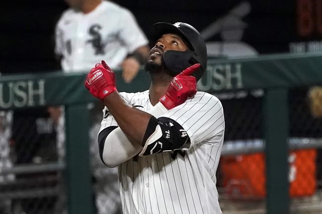 Chicago White Sox's Eloy Jimenez celebrates his three-run home run off Detroit Tigers relief pitcher Jose Cisnero during the sixth inning of a baseball game Friday, Sept. 11, 2020, in Chicago. (AP Photo/Charles Rex Arbogast)