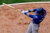 Kansas City Royals' Andrew Benintendi hits a one-run single during the eighth inning of a baseball game against the Chicago White Sox in Chicago, Sunday, April 11, 2021. (AP Photo/Nam Y. Huh)