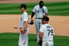 Chicago White Sox relief pitcher Drew Anderson, left, third baseman Yoan Moncada, center, and first baseman Jose Abreu, right, wait for manager Rick Renteria after Cleveland Indians' Jordan Luplow hit a two-run home run during the fourth inning of a baseball game in Chicago, Saturday, Aug. 8, 2020. (AP Photo/Nam Y. Huh)