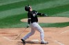 Chicago White Sox's Yasmani Grandal watches after hitting a ball during baseball practice at Guaranteed Rate Field in Chicago, Thursday, July 9, 2020. (AP Photo/Nam Y. Huh)