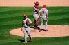 St. Louis Cardinals relief pitcher Roel Ramirez heads to the dugout after giving up four home runs in a row to the Chicago White Sox during the fifth inning of a baseball game Sunday, Aug. 16, 2020, in Chicago. Manager Mike Shildt, (8) and catcher Andrew Knizner wait on the mound for reliever Seth Elledge. (AP Photo/Charles Rex Arbogast)