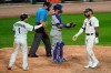Chicago White Sox's Yoan Moncada, right, is congratulated by Nick Madrigal after hitting a two-run home run during the sixth inning of the team's baseball game against the Chicago Cubs in Chicago, Saturday, Sept. 26, 2020. (AP Photo/Nam Y. Huh)