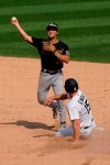 Pittsburgh Pirates second baseman Adam Frazier, left, throws out Chicago White Sox's Edwin Encarnacion at first after forcing out Adam Engel at second during the seventh inning of a baseball game in Chicago, Wednesday, Aug. 26, 2020. (AP Photo/Nam Y. Huh)