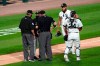 Chicago White Sox manager Rick Renteria, second from left, argues with umpires as catcher Yasmani Grandal, right, and relief pitcher Jimmy Cordero react during the seventh inning of a baseball game against the Chicago Cubs in Chicago, Friday, Sept. 25, 2020. Cordero ejected by home plate umpire Dan Bellino. (AP Photo/Nam Y. Huh)