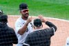 Chicago White Sox's Jose Abreu, left, and manager Rick Renteria celebrate after the White Sox clinched a playoff berth with a 4-3 win over the Minnesota Twins in a baseball game Thursday, Sept. 17, 2020, in Chicago. (AP Photo/Charles Rex Arbogast)
