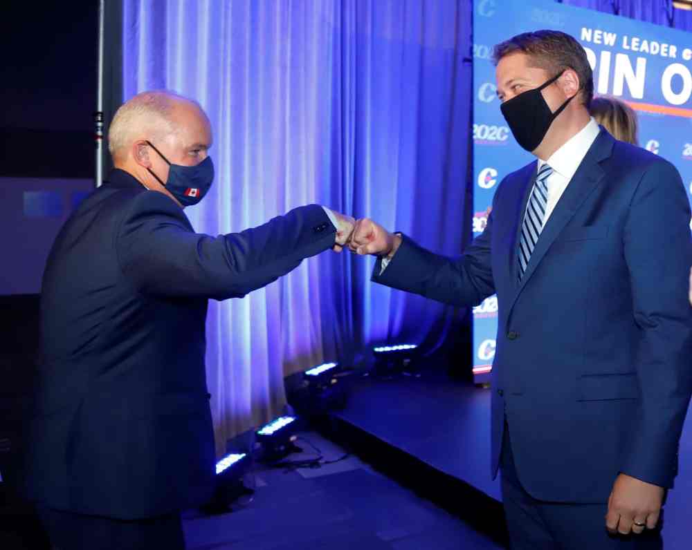 CP
Conservative Party of Canada Leader Erin O'Toole fist bumps former leader Andrew Scheer after O'Toole's win at the 2020 Leadership Election in Ottawa. (Patrick Doyle / Canadian Press)