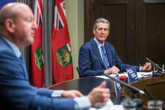 MIKAELA MACKENZIE / WINNIPEG FREE PRESSPremier Brian Pallister (right) and chief public health officer Dr. Brent Roussin make an announcement about changes in public health orders at the Manitoba Legislative Building in Winnipeg on Tuesday.