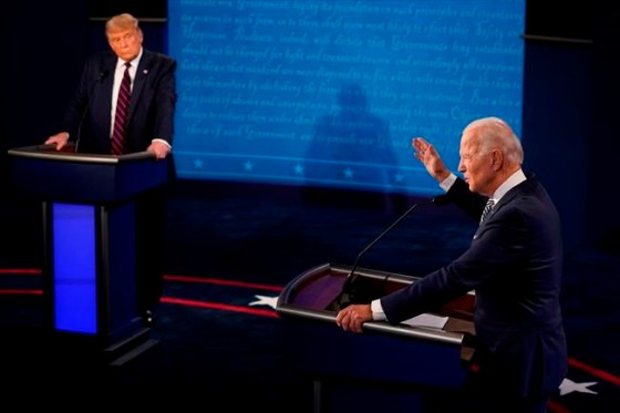 President Donald Trump listens to Democratic presidential candidate former Vice President Joe Biden during the first presidential debate Tuesday, Sept. 29, 2020, at Case Western University and Cleveland Clinic, in Cleveland, Ohio. (AP Photo/Morry Gash, Pool)