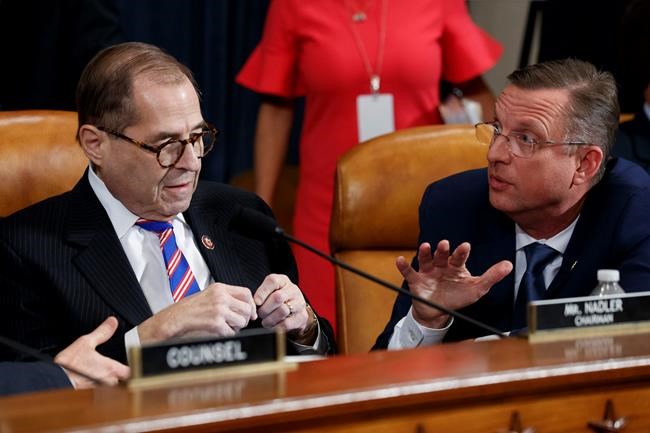 House Judiciary Committee Chairman Rep. Jerrold Nadler, D-N.Y., left, listens to ranking member Rep. Doug Collins, R-Ga., after the House Judiciary Committee hearing on the constitutional grounds for the impeachment of President Donald Trump, on Capitol Hill in Washington, Wednesday, Dec. 4, 2019 (AP Photo/Alex Brandon)