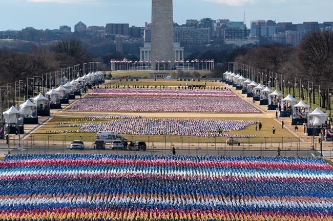 Flags are placed on the National Mall, looking towards the Washington Monument, and the Lincoln Memorial, ahead of the inauguration of President-elect Joe Biden and Vice President-elect Kamala Harris, Monday, Jan. 18, 2021, in Washington. (AP Photo/Alex Brandon)