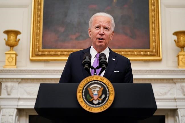 President Joe Biden speaks about the coronavirus in the State Dinning Room of the White House, Thursday, Jan. 21, 2021, in Washington. (AP Photo/Alex Brandon)