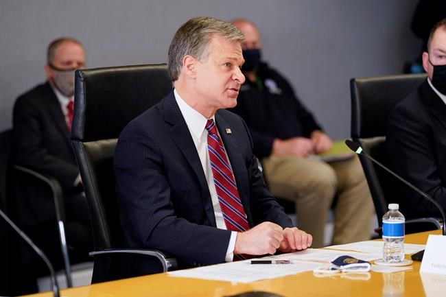 FBI Director Christopher Wray speaks during a briefing about the upcoming presidential inauguration of President-elect Joe Biden and Vice President-elect Kamala Harris, at FEMA headquarters, Thursday, Jan. 14, 2021, in Washington. (AP Photo/Alex Brandon, Pool)