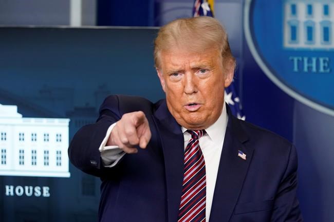 President Donald Trump calls for questions during a news conference in the James Brady Press Briefing Room at the White House, Wednesday, Aug. 12, 2020, in Washington. (AP Photo/Andrew Harnik)