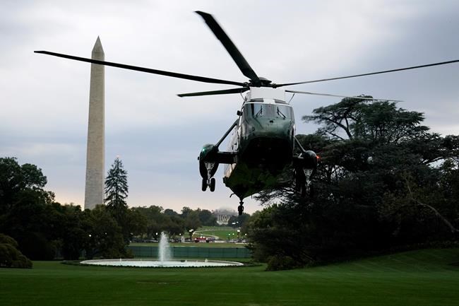 Marine One with President Donald Trump aboard lands on the South Lawn in Washington, Thursday, Oct. 1, 2020, as Trump returns from Bedminster, N.J. (AP Photo/Carolyn Kaster)