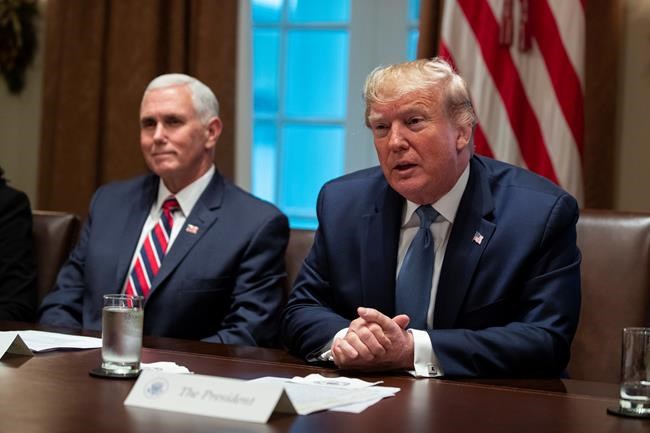 Vice President Mike Pence listens as President Donald Trump speaks during a roundtable on school choice in the Cabinet Room of the White House, Monday, Dec. 9, 2019, in Washington. (AP Photo/ Evan Vucci)