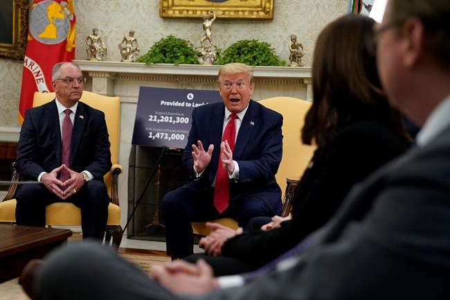 President Donald Trump speaks during a meeting about the coronavirus with Louisiana Gov. John Bel Edwards, left, in the Oval Office of the White House, Wednesday, April 29, 2020, in Washington. (AP Photo/Evan Vucci)