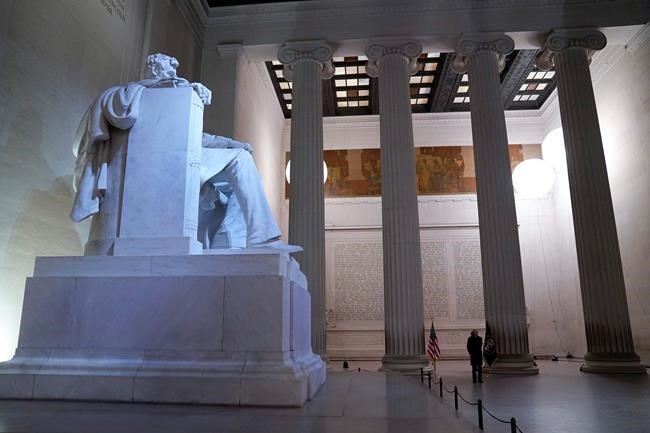 President Joe Biden stands in the Lincoln Memorial during Inauguration Day ceremonies, Wednesday, Jan. 20, 2021, in Washington. (AP Photo/Evan Vucci)