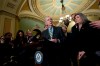 Senate Majority Leader Mitch McConnell, R-Ky., accompanied by Sen. Joni Ernst R-Iowa, and other senators, speaks outside of the Senate chamber, on Capitol Hill in Washington, Tuesday, Jan. 14, 2020. (AP Photo/Jose Luis Magana)