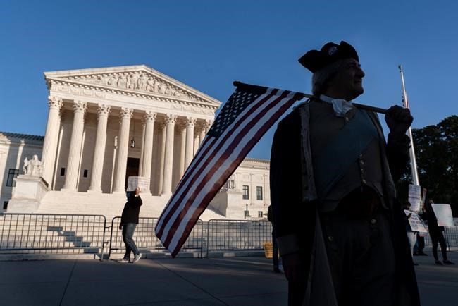 James Manship, playing George Washington, rallies in support of the nomination Amy Coney Barrett to the Supreme Court, outside the Supreme Court, Monday, Oct. 26, 2020, on Capitol Hill in Washington. (AP Photo/Jacquelyn Martin)