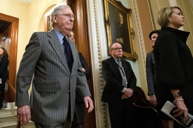 Senate Majority Leader Mitch McConnell of Ky., walks from the Senate Chamber after the delivery of the articles of impeachment against President Donald Trump to Secretary of the Senate Julie Adams on Capitol Hill in Washington, Wednesday, Jan. 15, 2020. (AP Photo/Matt Rourke)