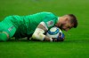 Bordeaux's goalkeeper Benoit Costil hugs the ball during the French League One soccer match between Marseille and Bordeaux at the Velodrome stadium in Marseille, southern France, Sunday, Dec. 08, 2019. (AP Photo/Daniel Cole)