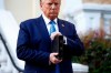 President Donald Trump holds a Bible as he visits outside St. John's Church across Lafayette Park from the White House Monday, June 1, 2020, in Washington. Part of the church was set on fire during protests on Sunday night. (AP Photo/Patrick Semansky)