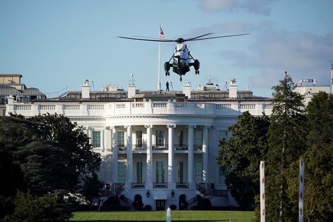 The helicopter that will carry President Donald Trump to Walter Reed National Military Medical Center in Bethesda, Md., lands on the South Lawn of White House in Washington, Friday, Oct. 2, 2020. The White House says Trump will spend a