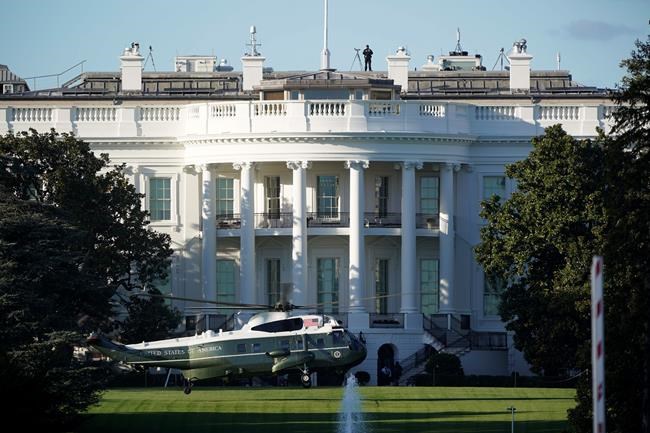 The helicopter that will carry President Donald Trump to Walter Reed National Military Medical Center in Bethesda, Md., lands on the South Lawn of White House in Washington, Friday, Oct. 2, 2020. The White House says Trump will spend a