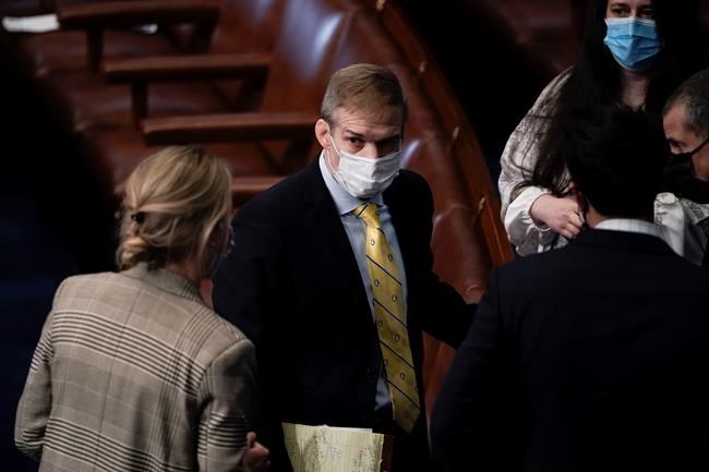 Rep. Jim Jordan, R-Ohio, talks with others after the U.S. House voted to impeach President Donald Trump in Washington, Wednesday, Jan. 13, 2021. Trump is charged with