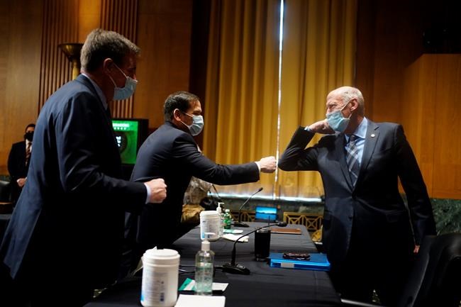 Former Director of National Intelligence Daniel Coats and Sen. Marco Rubio, R-Fla., greet each other before the confirmation hearing for President-elect Joe Biden’s pick for national intelligence director Avril Haines before the Senate intelligence committee on Tuesday, Jan. 19, 2021, in Washington. (Melina Mara/The Washington Post via AP, Pool)