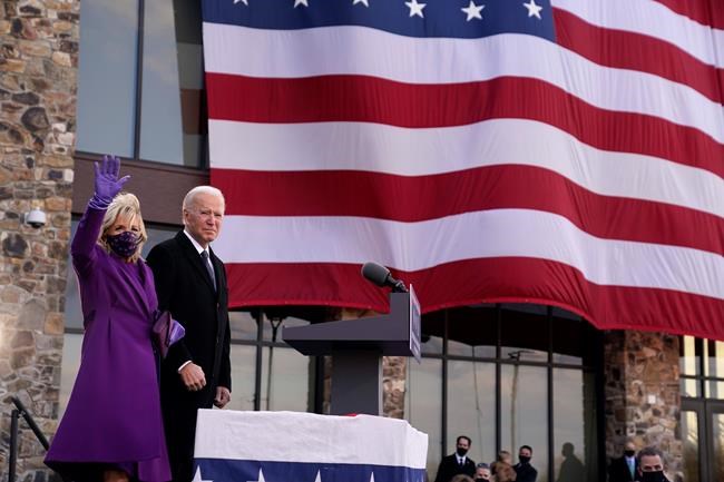 President-elect Joe Biden stands with his wife Jill Biden after speaking at the Major Joseph R.