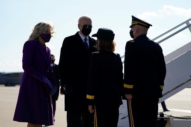 President-elect Joe Biden and his wife Jill Biden board a plane at New Castle Airport, Tuesday, Jan. 19, 2021, in New Castle, Del. (AP Photo/Evan Vucci)