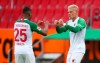 FILE - In this June 7, 2020 file photo, FC Augsburg's Philipp Max celebrates after scoring scoring against 1. FC Cologne in Augsburg, Germany. Germany coach Joachim Loew has called up two debutants for his team’s upcoming friendly against the Czech Republic and Nations League games against Ukraine and Spain. Loew named PSV Eindhoven’s Philipp Max and Augsburg’s Felix Uduokhai, both defenders, in his 29-member squad Friday, when Thilo Kehrer (Paris Saint-Germain), Ilkay Gundogan (Manchester City) and Leroy Sane (Bayern Munich) also returned after missing the October internationals. (Michael Dalder, Pool via AP, FILE)