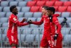Alphonso Davies, Robert Lewandowski and Kingsley Coman of Munich, from left, celebrate the opening goal during the Bundesliga soccer match between Bayern Munich and SC Freiburg in Munich, Germany, Sunday, Jan. 17, 2021. Photo: (Sven Hoppe/dpa via AP)