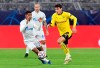 Dortmund's Giovanni Reyna, right, and Zenit's Wilmar Barrios, left, challenge for the ball during the Champions League group F soccer match between Borussia Dortmund and Zenit Saint Petersburg in Dortmund, Germany, Wednesday, Oct. 28, 2020. (Bernd Thissen/Pool via AP)