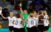 FILE - In this Tuesday, Aug. 16, 2016 file photo, Germany's goalkeeper Almuth Schult, center, celebrates with teammates after beating Canada 2-0 to reach the final of the women's Olympic football tournament at the Mineirao Stadium in Belo Horizonte, Brazil. German soccer federation president Fritz Keller says female players still have to deal with structural discrimination in Germany. Keller made his comments Tuesday after a video conference the day before with Germany captain Alexandra Popp and goalkeeper Almuth Schult to discuss the fall-out from a sports court case that apparently ordered a male coach to take charge of a female team's training sessions as part of his punishment for verbally abusing female match officials. (AP Photo/Leo Correa, file)
