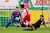 Freiburg's Woo-yeong Jeong, center, scores his side second goal against Stuttgart's goalkeeper Gregor Kobel, left, and Stuttgart's Marc Oliver Kempf, right, during the German Bundesliga soccer match between SC Freiburg and VfB Stuttgart in Freiburg, Germany, Saturday, Jan. 23, 2021. (Tom Weller/dpa via AP)