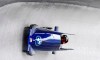 United States bobsledders Kaillie Humphries and Lauren Gibbs speed down the track during the two-women race of bobsled World Cup in Schoenau am Koenigsee, Germany, Sunday, Jan. 24, 2021. (Tobias Hase/dpa via AP)