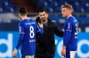 Schalke's coach Dimitrios Grammozis, center, goes to Schalke's Suat Serdar, left, and Schalke's Timo Becker, right, after the German Bundesliga soccer match between FC Schalke 04 and Borussia Moenchengladbach at Veltins Arena, Gelsenkirchen, Germany, Saturday March 20, 2021. After loosing the match 0-3 Schalke is last in the Bundesliga with little to no hope of survival. (Guido Kirchner/dpa via AP)