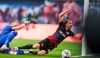 Duesseldorf's goalkeeper Florian Kastenmeier, left, stops Leipzig's Kevin Kampl during the German Bundesliga soccer match between RB Leipzig and Fortuna Duesseldorf in Leipzig, Germany, Wednesday, June 17. 2020. (Jan Woitas/Pool via AP)