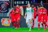 Leverkusen's Moussa Diaby, left, celebrates with Jonathan Tah, second from left, after scoring his side opening goal during the German Bundesliga soccer match between Bayer Leverkusen and FC Augsburg in Leverkusen, Germany, Sunday, Feb. 23, 2020. (Rolf Vennenbernd/dpa via AP)