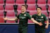 Stuttgart's Sasa Kalajdzic, left, celebrates Marc Oliver Kempf after he scores the opening goal during the German Bundesliga soccer match between 1. FC Koeln and VfB Stuttgart in Cologne, Germany, Saturday, Feb. 20, 2021.( Rolf Vennenbernd/dpa via AP)
