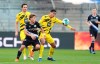 Bielefeld's Ritsu Doan, right, fights for the ball with Jude Bellingham, right, from Dortmund, during the German Bundesliga soccer match between Arminia Bielefeld and Borussia Dortmund in Bielefeld, Germany, Saturday, Oct. 31, 2020. (Friso Gentsch/dpa via AP)