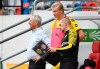 Dortmund's Erling Haaland, center, waits to be substitution near Dortmund coach Lucien Favre, left, during the German Bundesliga soccer match between Fortuna Duesseldorf and Borussia Dortmund in Duesseldorf, Germany, Saturday, June 13, 2020. Because of the coronavirus outbreak all soccer matches of the German Bundesliga take place without spectators. (Bernd Thissen/Pool via AP)