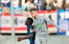 Paderborn's Jamilu Collins, left, and Berlin's Peter Pekarik head for the ball during the German Bundesliga soccer match between SC Paderborn 07 and Hertha BSC Berlin in Paderborn, Germany, Saturday, Feb. 15, 2020. (Friso Gentsch/dpa via AP)