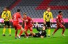 Bayern Munich's Joshua Kimmich, center left, celebrates scoring his side third goal during the German Bundesliga Supercup soccer match between FC Bayern Munich and Borussia Dortmund in Munich, Germany, Wednesday, Sept. 30, 2020. (Sven Hoppe/Pool via AP)