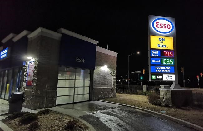 Gas prices are shown on a sign at an Esso station in Whitby, Ont., east of Toronto, on Wednesday, March 18, 2020. Parkland Fuel Corp. says it is cutting its 2020 capital spending budget by 52 per cent and cutting its executive salaries in response to the uncertain economic impact of the novel coronavirus.THE CANADIAN PRESS/ Doug Ives