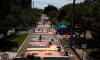 Local artists collaborate on painting a Black Lives Matter street mural in front of the Dr. Carter G. Woodson African American Museum, in St. Petersburg, Fla., on Thursday, June 18, 2020. Americans are gathering today to mark the anniversary of an emancipation that came two and a half years late — liberty that many say feels like it never came at all. THE CANADIAN PRESS/Dirk Shadd/Tampa Bay Times via AP *MANDATORY CREDIT*