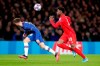 Chelsea's Mason Mount, left, and Bayern's Alphonso Davies go for the ball during the Champions League round of 16 soccer match between Chelsea and Bayern Munich at Stamford Bridge in London, England, Tuesday, Feb. 25, 2020. THE CANADIAN PRESS/AP-Frank Augstein